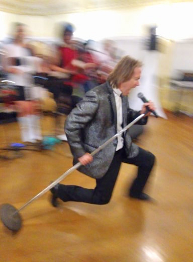 A man screaming into a microphone